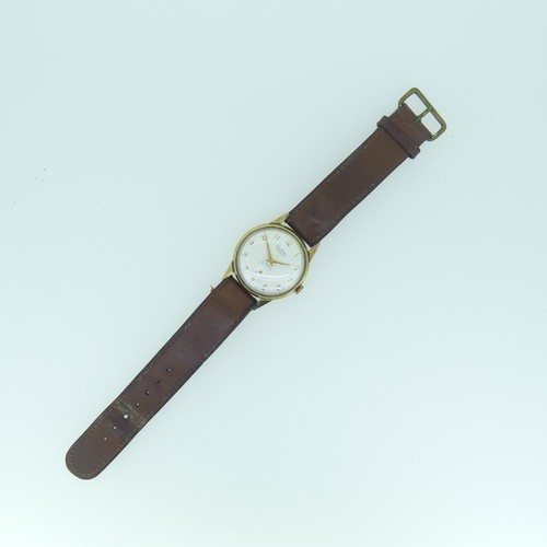 254 - A vintage Audax 9ct gold gentleman's Wristwatch, with Swiss movement, the circular dial with gilt Ar... 