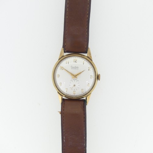 254 - A vintage Audax 9ct gold gentleman's Wristwatch, with Swiss movement, the circular dial with gilt Ar... 