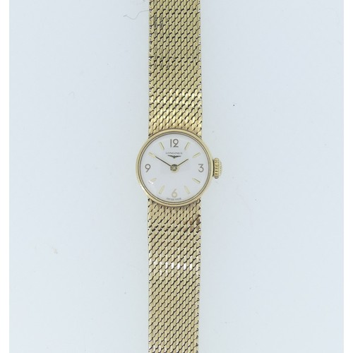 257 - A Longines 9ct gold lady's bracelet Wristwatch, the circular silvered dial with gilt Arabic and bato... 