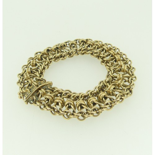 413 - A 9ct gold Bracelet, formed of open flexible ropemesh links, integral clasp, 20cm long, 37.6g.... 