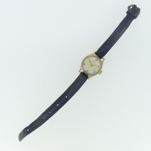 258 - A vintage Omega 9ct gold lady's Wristwatch, the silvered dial with black Roman numerals and button m... 