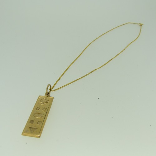 365 - A 9ct gold Ingot Pendant, 3.8cm long inc. suspension loop, on a 9ct gold trace chain, approx total w... 