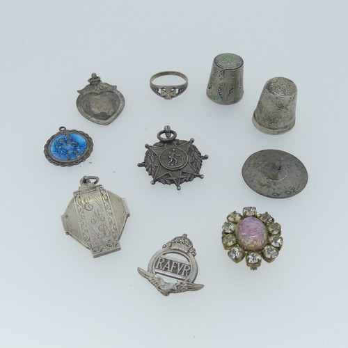 488 - Two silver St. Christopher Pendants, together with a quantity of silver fobs, a damaged ingot pendan... 