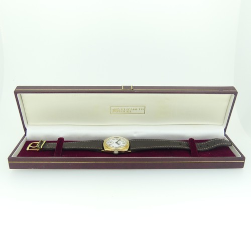 205A - A 1930's Benson 9ct gold gentleman's Wristwatch, with Swiss movement, the cushion-shaped case with c... 