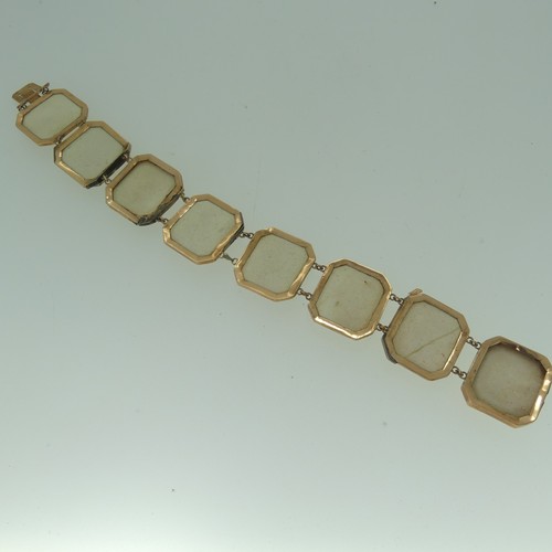 397 - A 19thC lava cameo Bracelet, formed of 8 plaques with male busts, mounted in 9ct rose gold, marked o... 