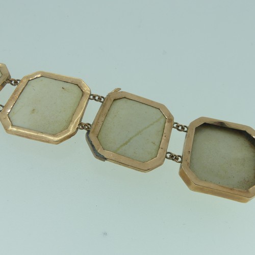 397 - A 19thC lava cameo Bracelet, formed of 8 plaques with male busts, mounted in 9ct rose gold, marked o... 