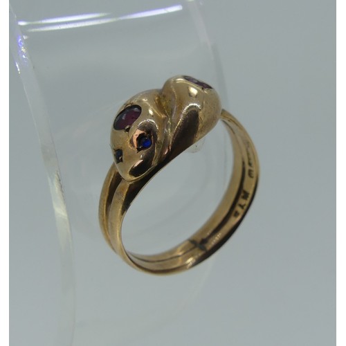 321 - An antique 9ct rose gold double snakes head Ring, the heads each set ruby and with two sapphire eyes... 