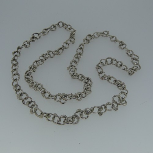 366 - Graham Watling; A silver Necklace, a continuous chain of abstract circular links, hallmarked for Jan... 