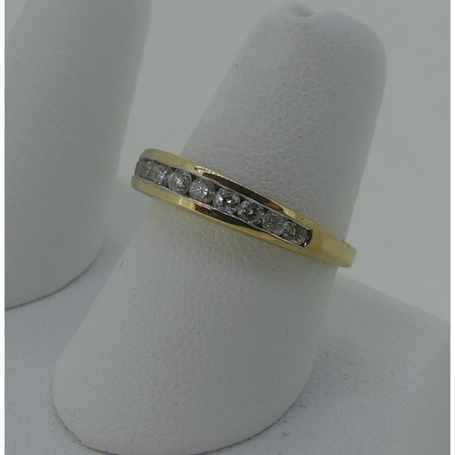 333 - A diamond set half hoop Eternity Ring, the thirteen graduated small diamonds channel set in 9ct yell... 