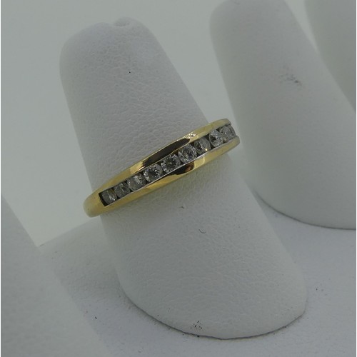 333 - A diamond set half hoop Eternity Ring, the thirteen graduated small diamonds channel set in 9ct yell... 