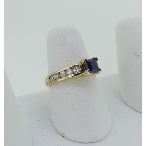 334 - A sapphire and diamond Ring, the central square sapphire 4.65mm wide, with five brilliant cut diamon... 