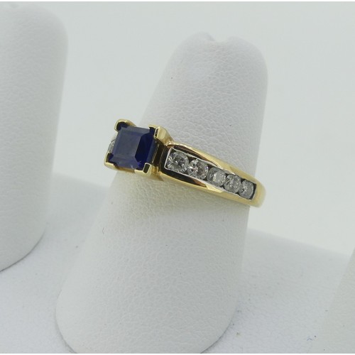 334 - A sapphire and diamond Ring, the central square sapphire 4.65mm wide, with five brilliant cut diamon... 