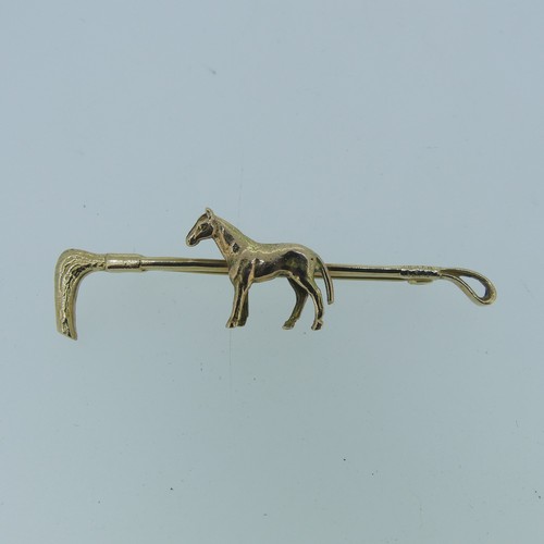 435 - A 9ct gold Bar Brooch, in the form of a riding crop, the centre modelled as a horse, 6.2cm long, app... 