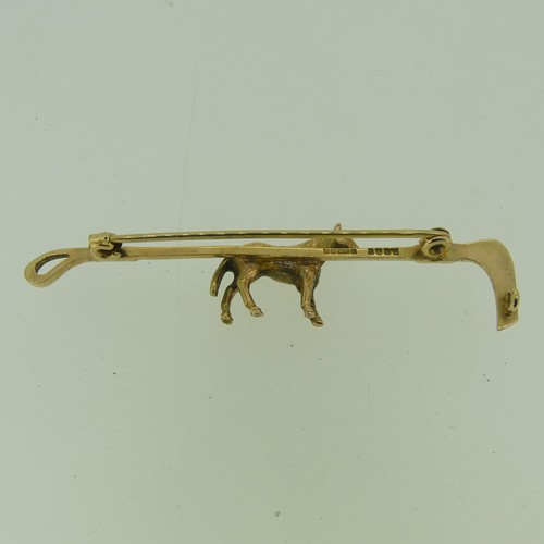 435 - A 9ct gold Bar Brooch, in the form of a riding crop, the centre modelled as a horse, 6.2cm long, app... 