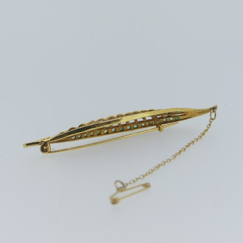 448 - A 9ct yellow gold Leaf Brooch, pierced and with two rows of small emeralds, 7cm long, approc weight ... 