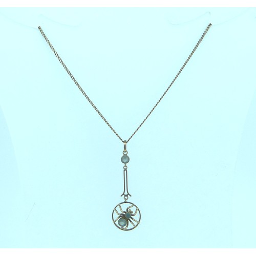 352 - A small Edwardian 9ct gold spider Pendant, the open circular pendant drop with central spider set tw... 