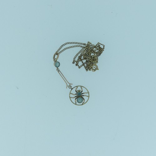 352 - A small Edwardian 9ct gold spider Pendant, the open circular pendant drop with central spider set tw... 