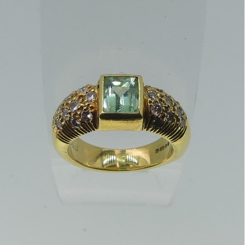 345 - An 18ct yellow gold, Topaz and diamond Dress Ring, the central rectangular facetted topaz, approx. 5... 