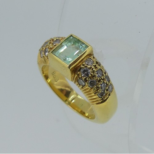 345 - An 18ct yellow gold, Topaz and diamond Dress Ring, the central rectangular facetted topaz, approx. 5... 