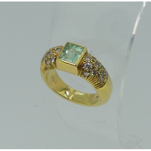 345 - An 18ct yellow gold, Topaz and diamond Dress Ring, the central rectangular facetted topaz, approx. 5... 