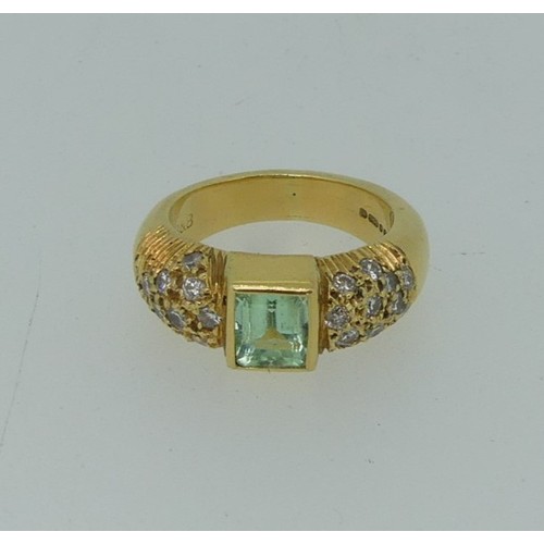 345 - An 18ct yellow gold, Topaz and diamond Dress Ring, the central rectangular facetted topaz, approx. 5... 