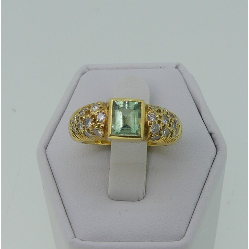 345 - An 18ct yellow gold, Topaz and diamond Dress Ring, the central rectangular facetted topaz, approx. 5... 