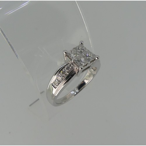 274 - An 18ct white gold diamond Ring, the square front formed of four princess stones, each approx 0.2ct ... 