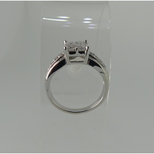 274 - An 18ct white gold diamond Ring, the square front formed of four princess stones, each approx 0.2ct ... 