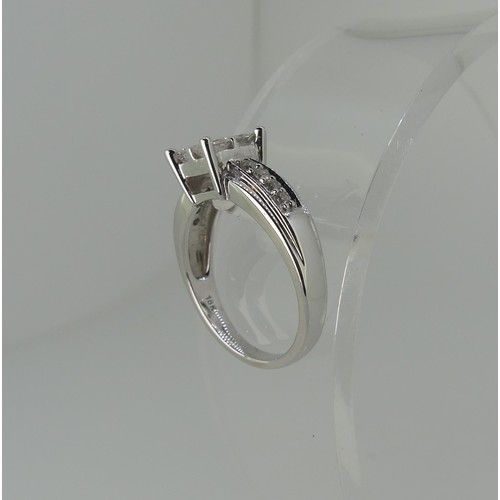 274 - An 18ct white gold diamond Ring, the square front formed of four princess stones, each approx 0.2ct ... 