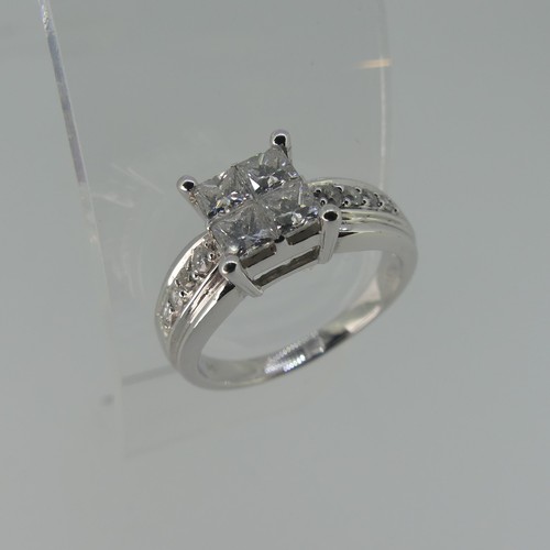 274 - An 18ct white gold diamond Ring, the square front formed of four princess stones, each approx 0.2ct ... 