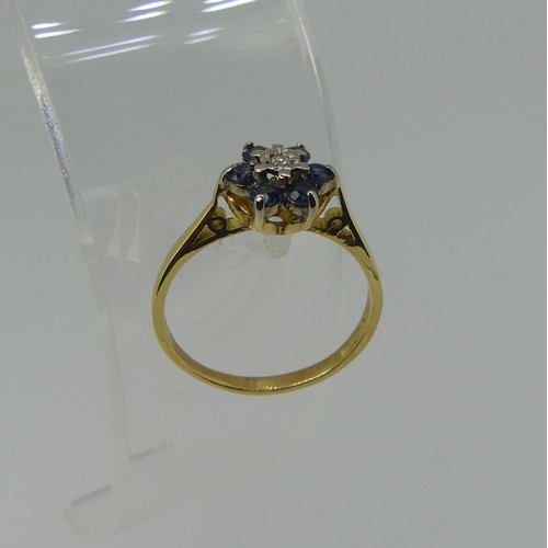 344 - A small sapphire and diamond cluster Ring, all mounted in 18ct yellow gold, Size N½, 2.6g.... 