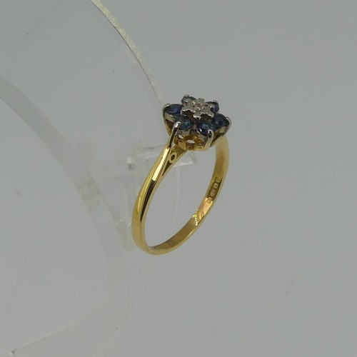 344 - A small sapphire and diamond cluster Ring, all mounted in 18ct yellow gold, Size N½, 2.6g.... 