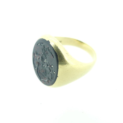 314 - A 14ct gold and bloodstone Signet Ring, the oval matrix crested, the shank marked 585 and tested, Si... 