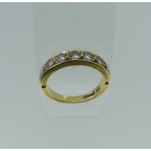 322 - A diamond half hoop Eternity Ring, the seven brilliant cut stones each approx. 0.075ct, claw set wit... 