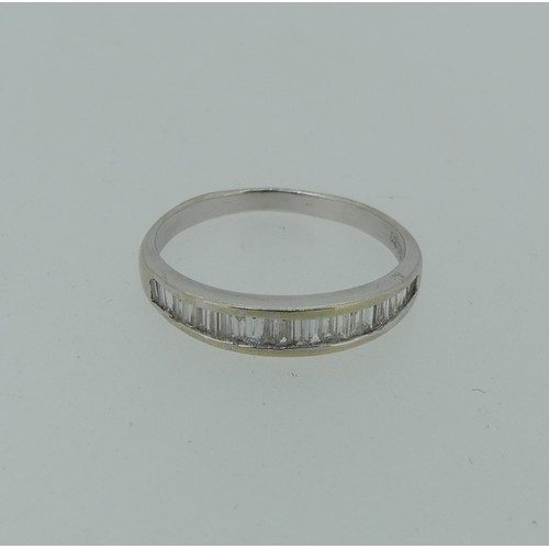 292 - An 18ct white gold diamond half hoop Eternity Ring, the graduated baguette diamonds channel set, est... 