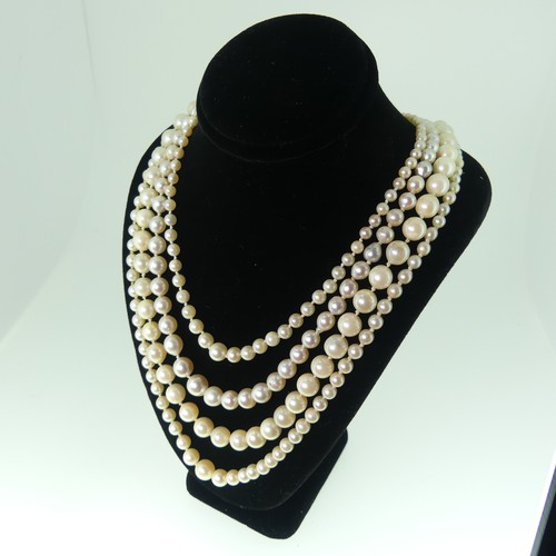 380 - A single row of baroque Cultured Pearls, on 9ct gold snap, 48cm long, together with a string of seed... 