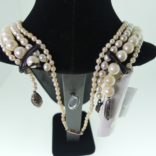 380 - A single row of baroque Cultured Pearls, on 9ct gold snap, 48cm long, together with a string of seed... 