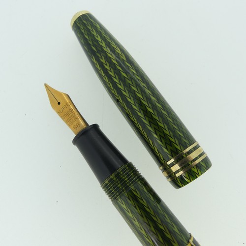 264 - Conway Stewart 77 fountain pen, green herring bone, in new unused condition with paper collar type 4... 