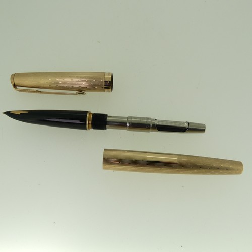 270 - A 9ct gold Parker Fountain Pen, with engine turned decoration and vacant cartouche, 13.5cm long, gro... 