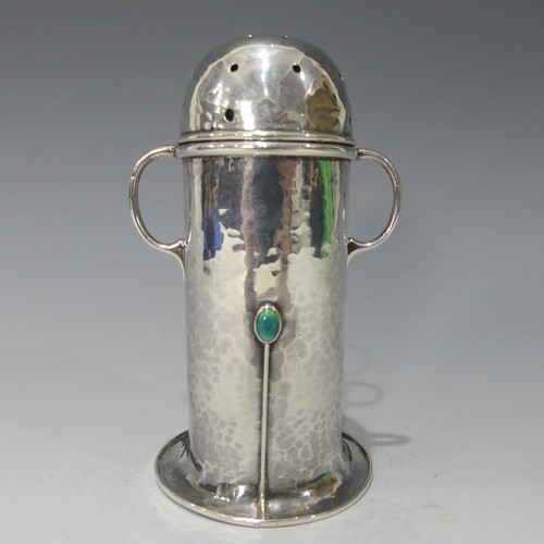 173 - A.E.Jones; An Edwardian silver Sugar Caster, hallmarked Birmingham, 1905, or lighthouse form with re...