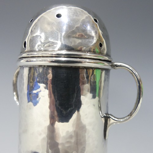 173 - A.E.Jones; An Edwardian silver Sugar Caster, hallmarked Birmingham, 1905, or lighthouse form with re... 