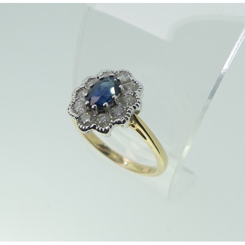 93 - A sapphire and diamond cluster Ring, the central oval facetted sapphire approx. 5.6x4.1mm, surrounde... 