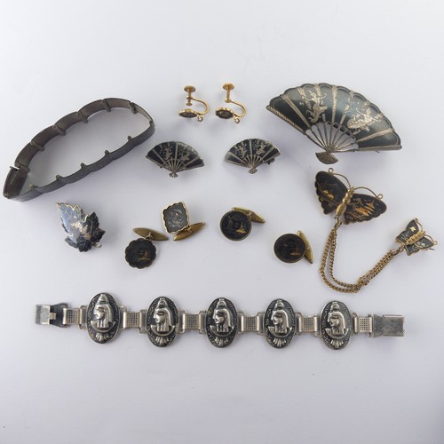 213 - A Japanese Shakudo Necklace, the panels decorated in traditional style with pagodas and foliage, 37c... 