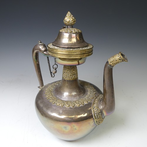 222 - A 19thC Tibetan silver and parcel-gilt ceremonial Teapot / Ewer, the plain tapering circular body wi... 