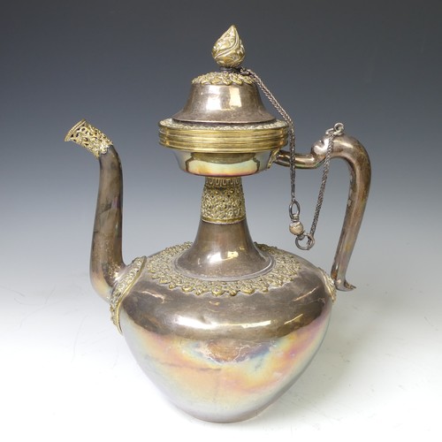 222 - A 19thC Tibetan silver and parcel-gilt ceremonial Teapot / Ewer, the plain tapering circular body wi... 