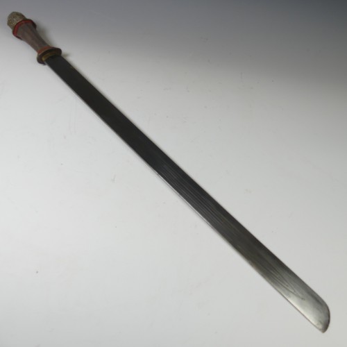 223 - A late 19thC Tibetan Sword, the single edged steel blade with pale shagreen grip and silver pommel, ... 