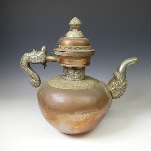 224 - A large Tibetan copper Tea Pot, with white metal mounts, the handle and spout modelled as a mythical... 