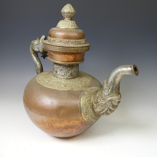 224 - A large Tibetan copper Tea Pot, with white metal mounts, the handle and spout modelled as a mythical... 