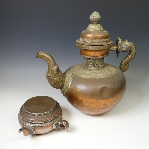 224 - A large Tibetan copper Tea Pot, with white metal mounts, the handle and spout modelled as a mythical... 