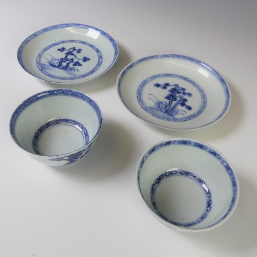 238 - A Nanking cargo type Tea Bowl and Saucer,  together with another Tea Bowl and Saucer, decorated in t... 